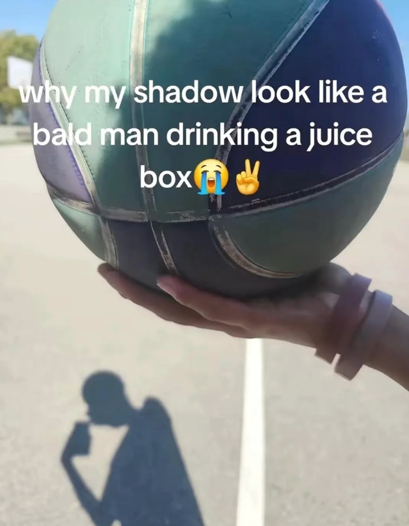 Hand holds a shot  with a shadiness   connected  the crushed  resembling a idiosyncratic   drinking from a foodstuff  box. Text humorously highlights the shadiness   illusion