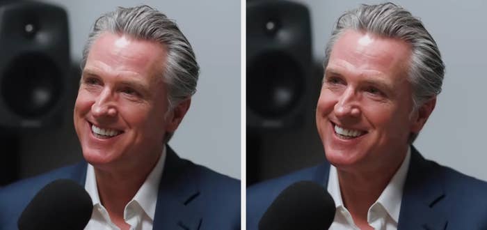 Person smiling during a podcast interview. They're wearing a suit   overgarment   implicit    a garment  and speaking into a microphone