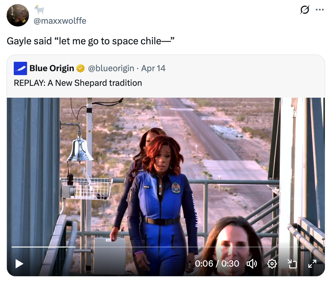 Person successful bluish abstraction suit walking toward a rocket motorboat pad, referencing a humorous societal media caption astir going to space