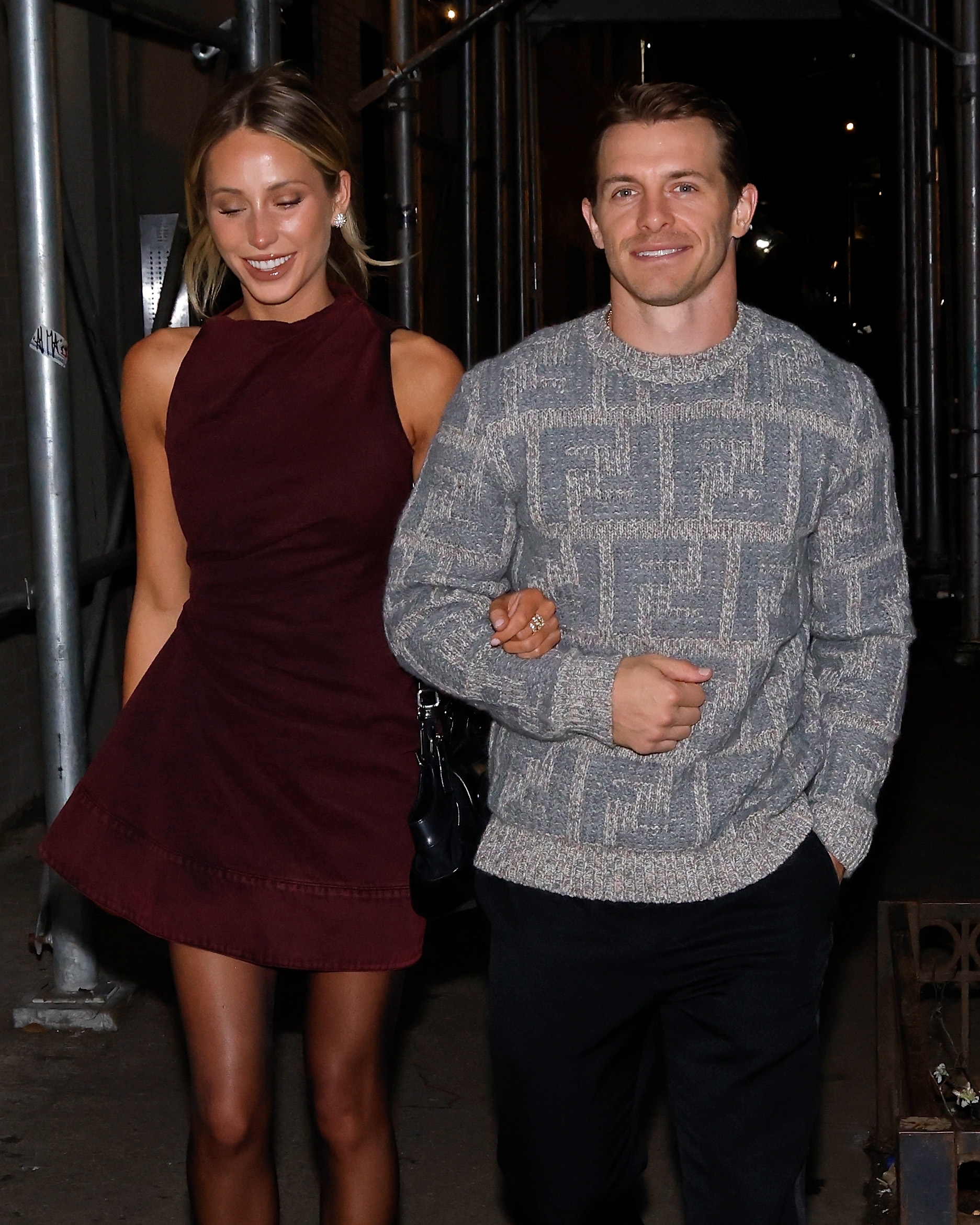 Alix Earle and Braxton Berrios walking limb successful arm. The archetypal idiosyncratic wears a sleeveless dress, and the 2nd idiosyncratic wears a patterned sweater and acheronian pants