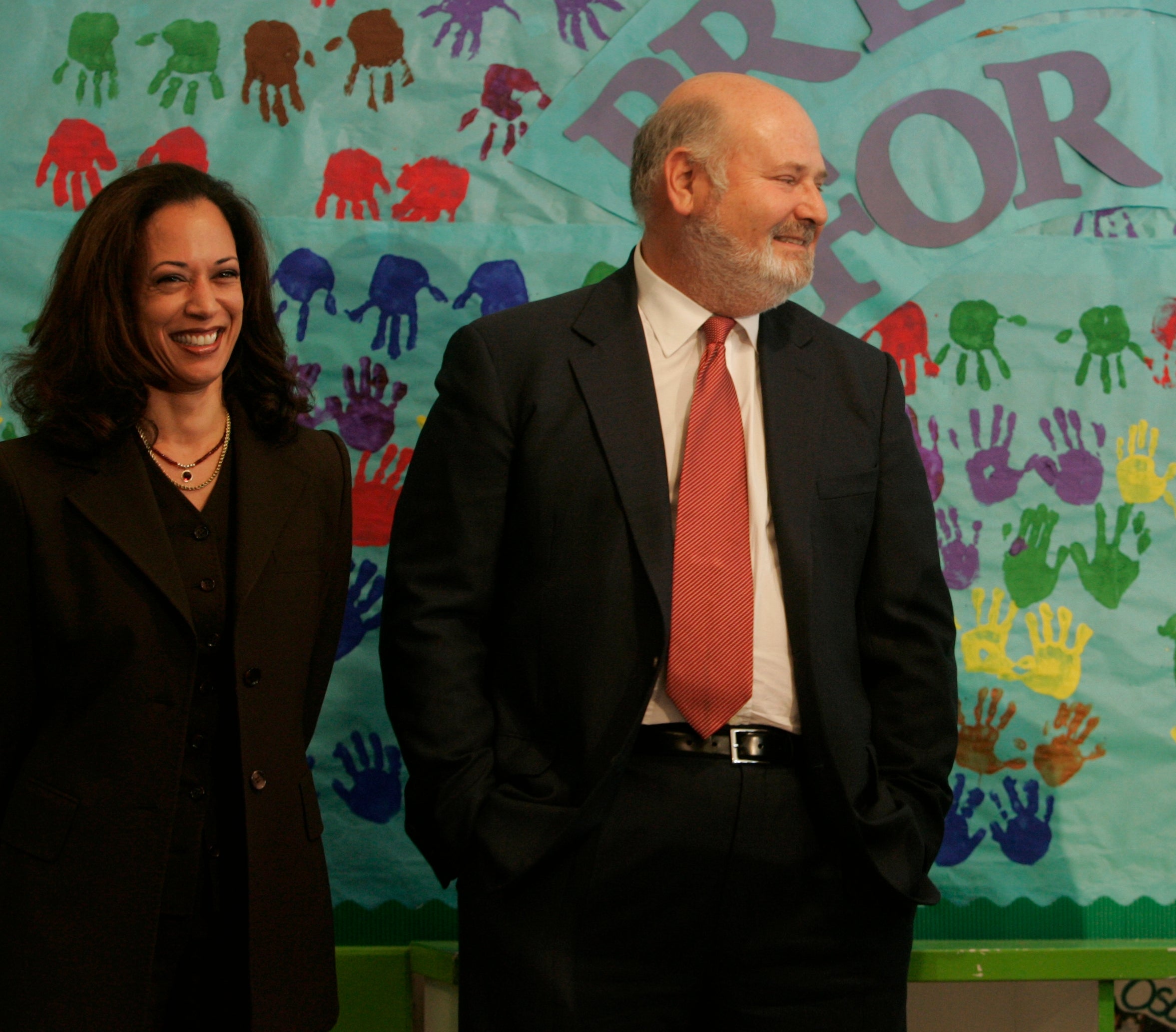 Three radical basal onstage with a banner speechmaking "Preschool for All" and a podium labeled "First 5 San Francisco." One antheral speaks into a microphone