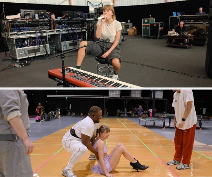 Person rehearsing in a studio setting, sitting on a stool with one leg up, surrounded by sound equipment and a keyboard in the foreground
