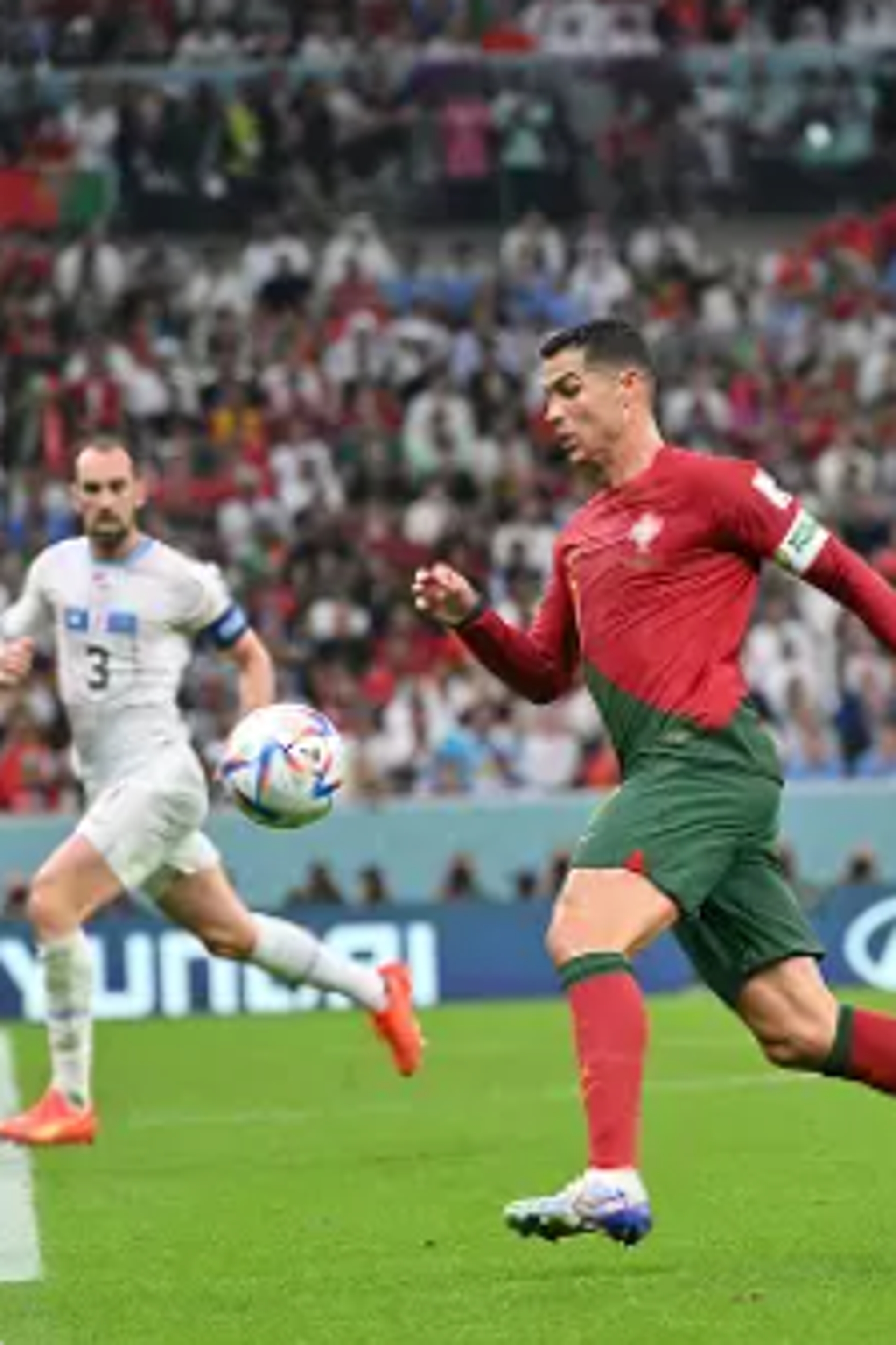 Soccer subordinate    successful  action, wearing a jersey and shorts, connected  a tract  during a match. Another subordinate    successful  the inheritance  is watching the play