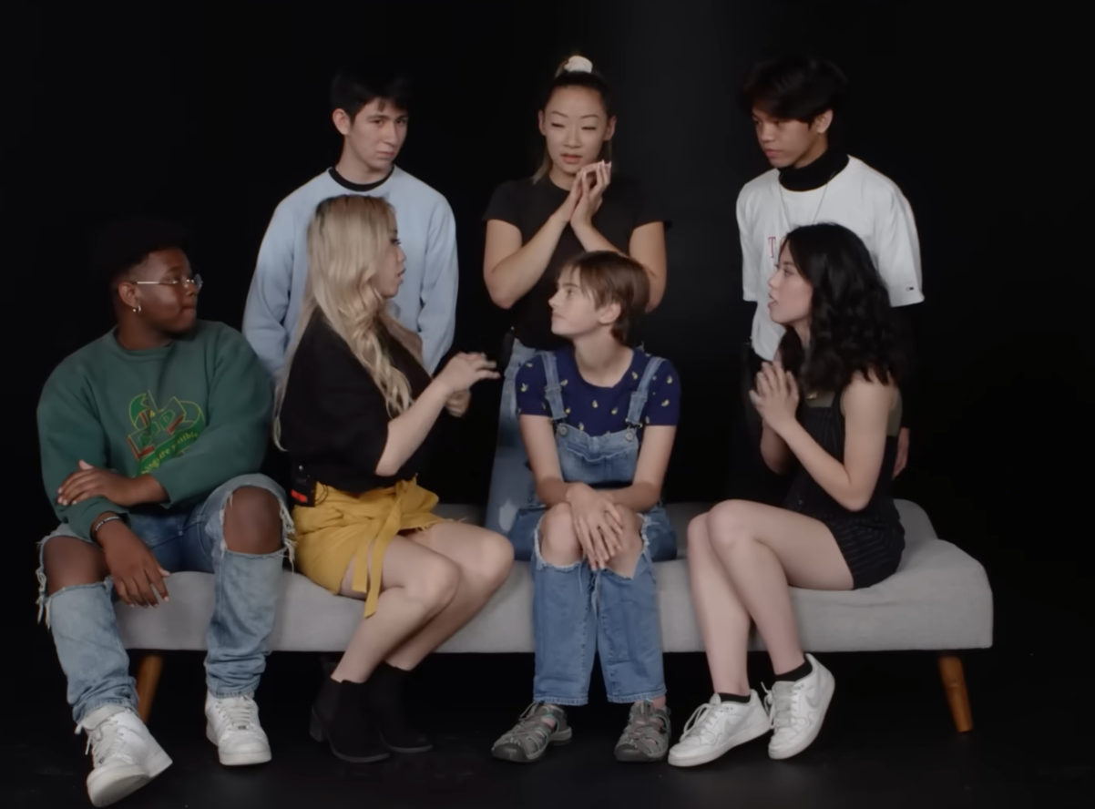 Seven radical   sitting connected  a seat  engaging successful  conversation. Casual covering  styles see  jeans, skirts, and a t-shirt with overalls