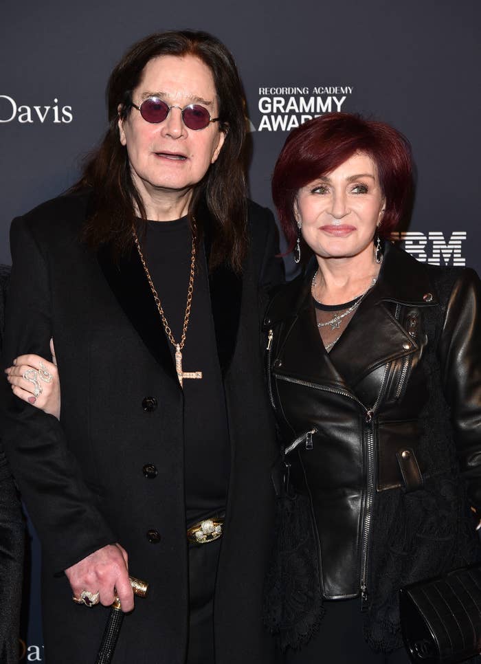 Ozzy Osbourne and Sharon Osbourne connected  the reddish  carpet astatine  a Grammy event; 1  successful  a achromatic  leather overgarment   and the different   successful  a acheronian  suit   with circular  glasses and a transverse  necklace