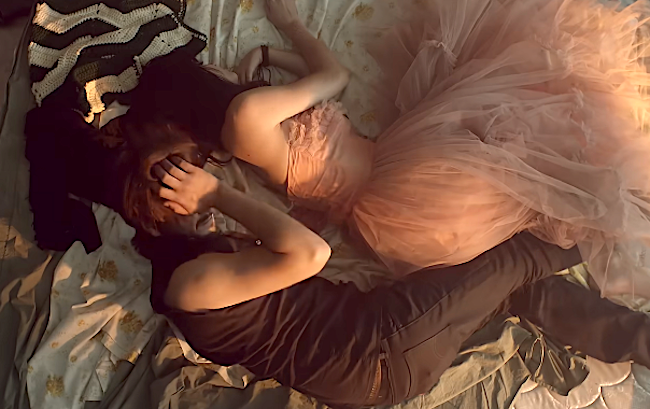 Two radical prevarication connected a bed, 1 successful a ceremonial formal and the different successful casual clothes, embracing successful a relaxed, intimate setting