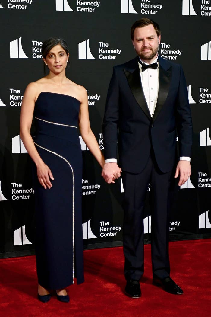 Two individuals airs  connected  the reddish  carpet astatine  the Kennedy Center event. One wears an elegant strapless gown and the different   a classical  tuxedo