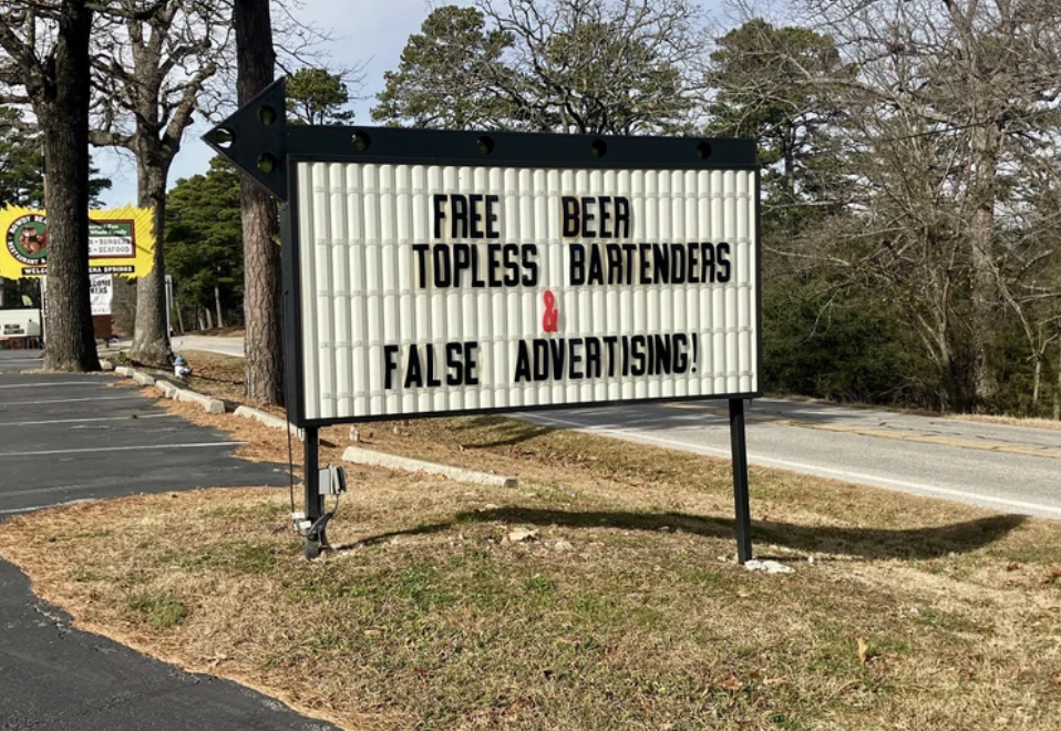  "Free Beer Topless Bartenders False Advertising!" with a reddish  arrow pointing to "False."