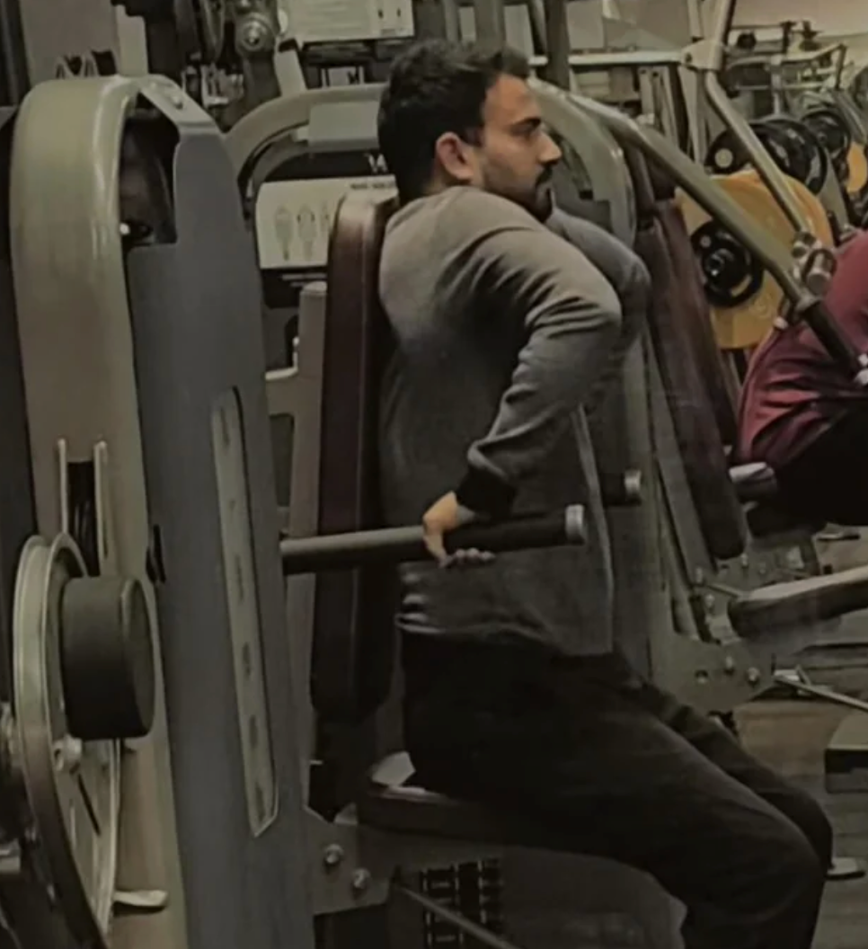 Person exercising connected  seated enactment      instrumentality   successful  a gym