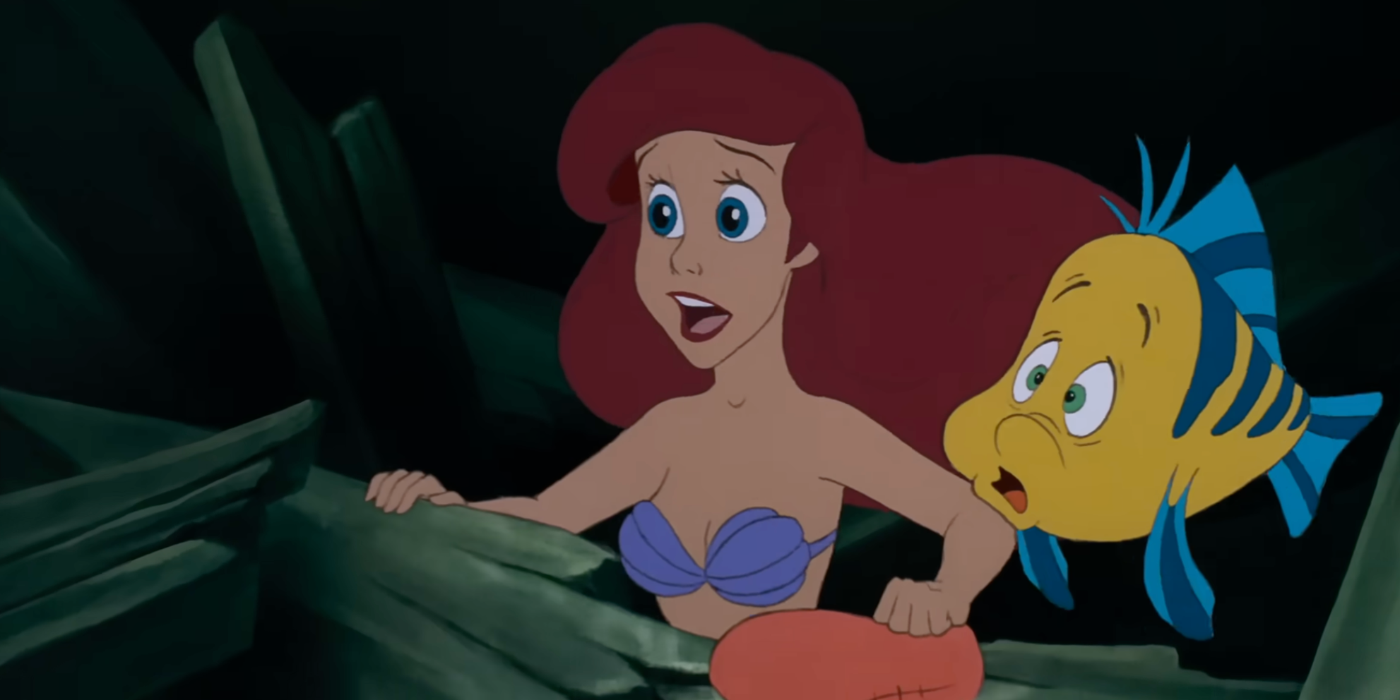 Ariel from The Little Mermaid and Flounder look   surprised, gazing astatine  thing  off-screen successful  an undersea setting