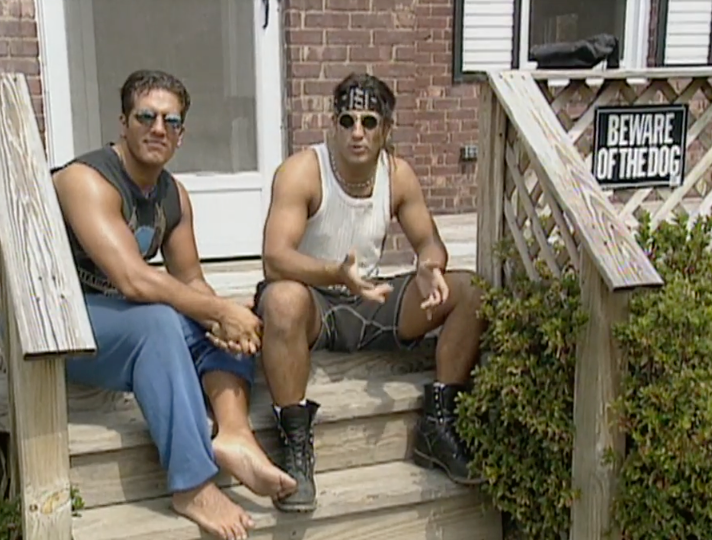 Two men beryllium connected woody steps; 1 is barefoot successful diversion wear, the different wears boots and a vessel top. A "Beware of the Dog" motion is visible