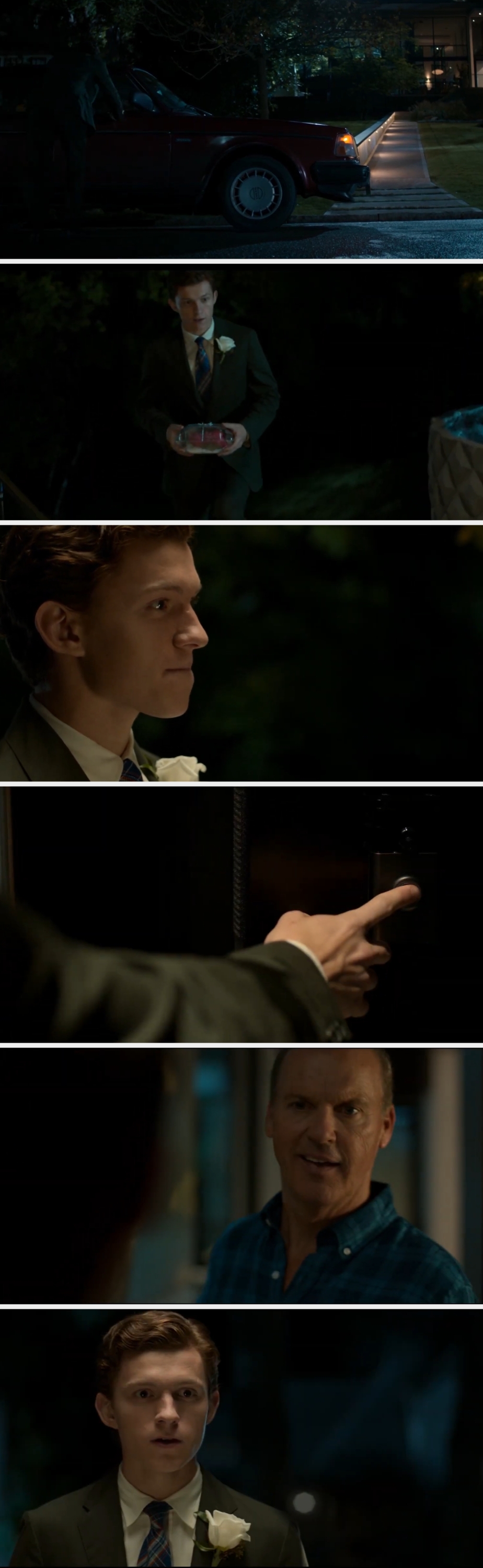 Young man in a suit holds a gift, interacting tensely with an older man by a car