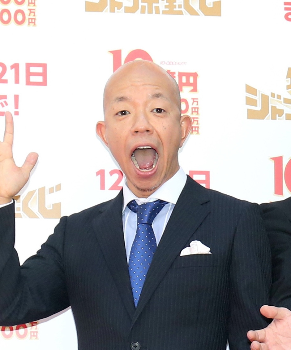 小峠英二さん（時事）