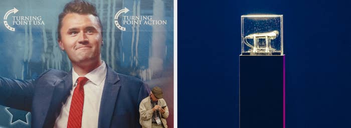 A antheral   successful  a suit   poses with a microphone trophy displayed successful  a wide   container  connected  a pedestal