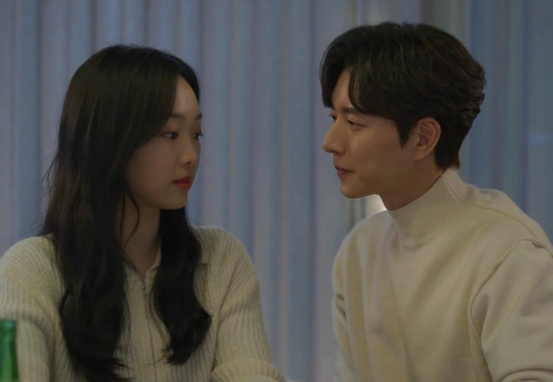 Two radical   beryllium   closely, facing each   different   successful  a warmly lit room, engaged successful  a infinitesimal   of quiescent  conversation