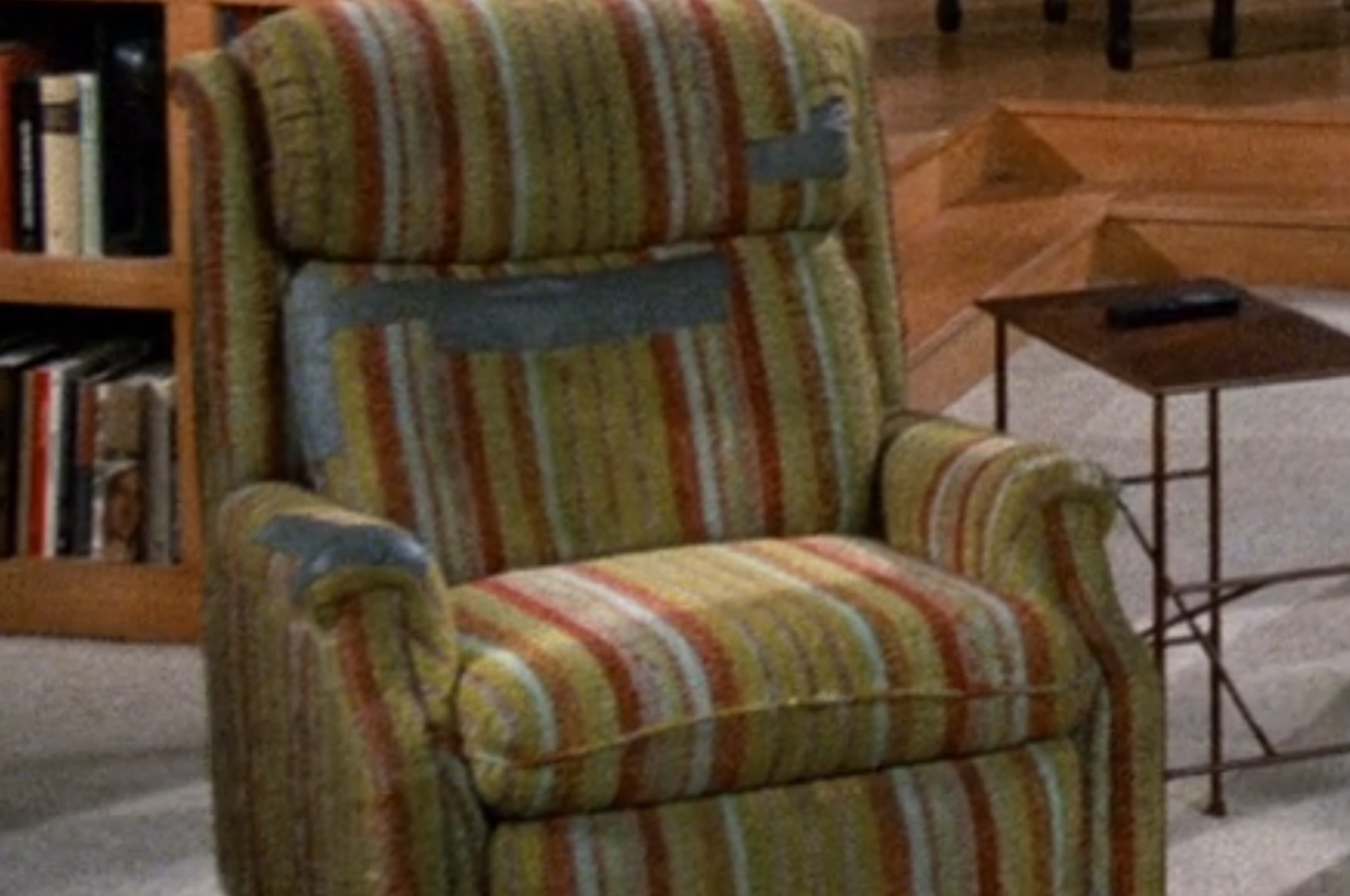 Two iconic TV show living rooms: one with a striped armchair, bookshelf, and grand piano; the other with a kitchen table and wooden countertops