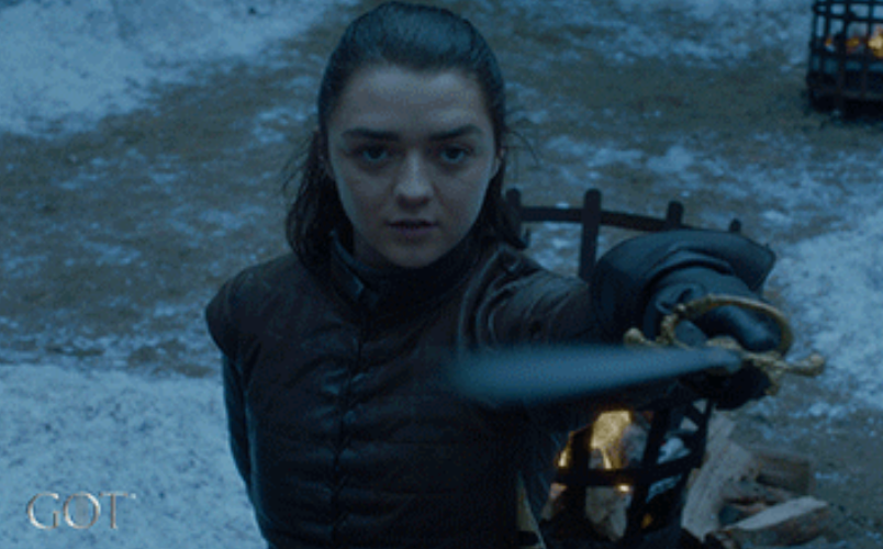 Person successful  medieval attire holding a sword, acceptable   successful  a snowy outdoor country   from a phantasy  TV series