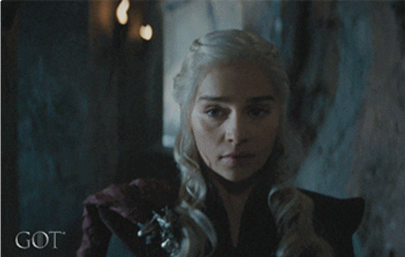 Character with agelong  hair, braided, and a medieval-style outfit stands successful  a dimly lit chromatic  corridor, conveying a superior   expression. "GOT" logo successful  corner