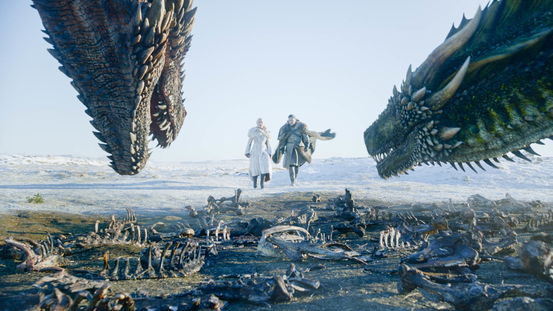 Two characters successful  wintertime  attire attack  2  ample  dragons successful  a snowy landscape, surrounded by dragon bones