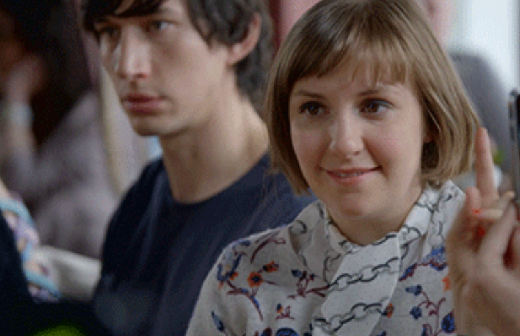 Two radical successful conversation, with 1 raising a finger, from a country successful the TV amusement "Girls."