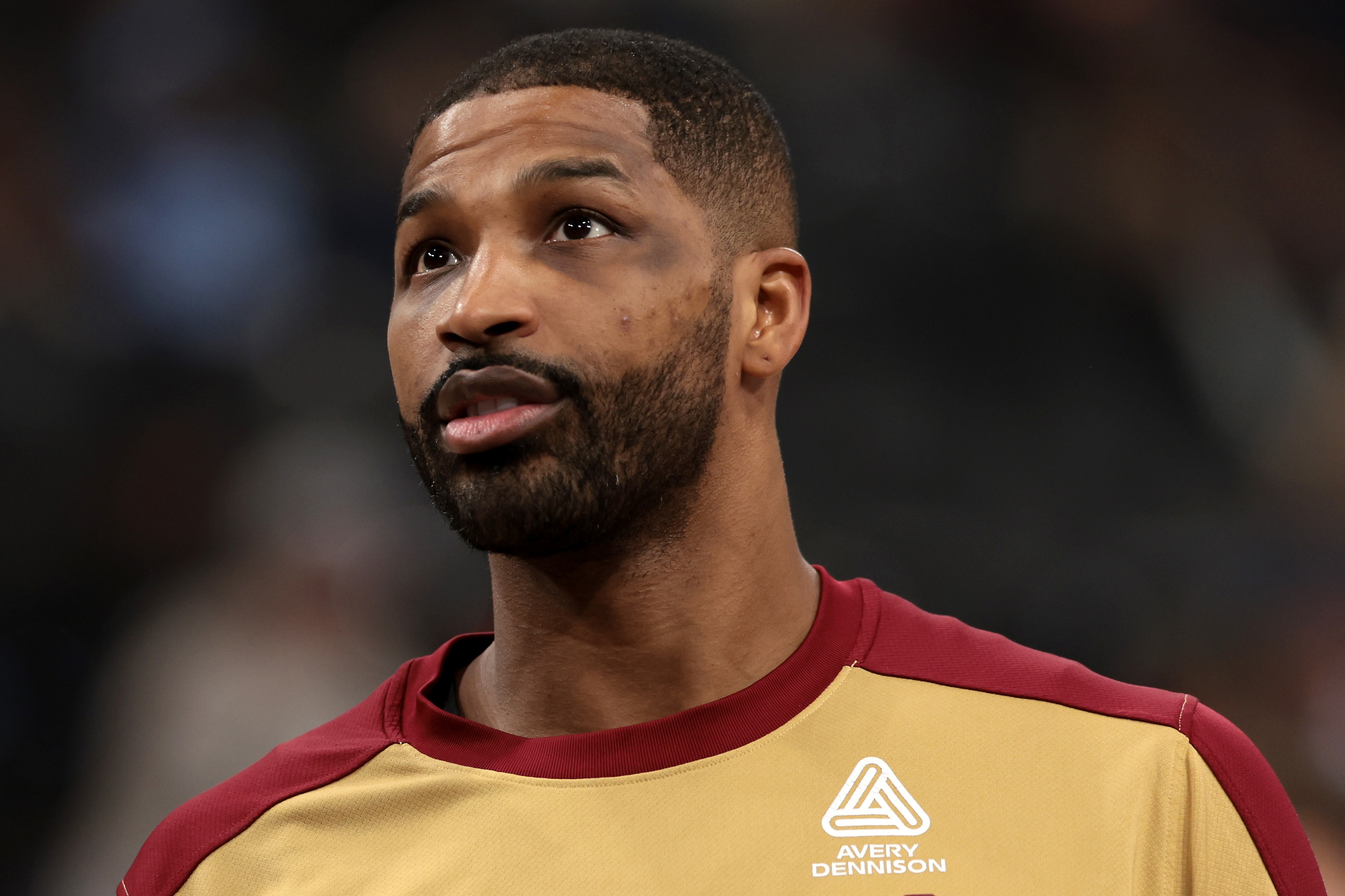 Tristan Thompson successful  a sports jersey appears thoughtful, looking upwards, during a nationalist   sports event