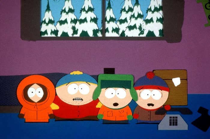 Animated characters Kenny, Cartman, Kyle, and Stan from "South Park" stand together indoors