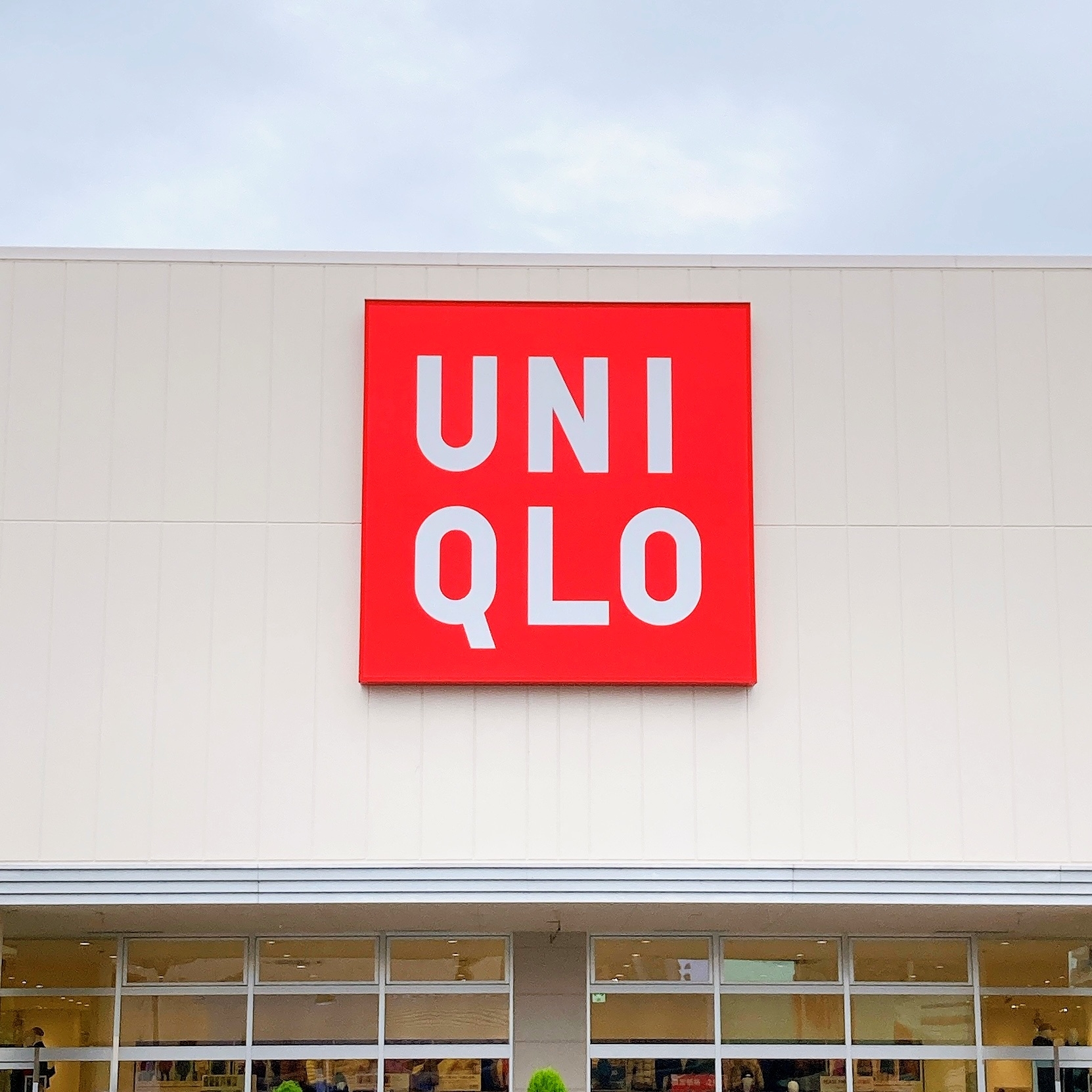 Uniqlo store facade with large Uniqlo logo displayed prominently above the entrance