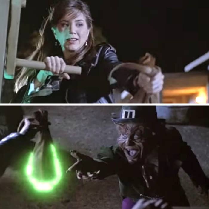 Aniston fending off a leprechaun in the film