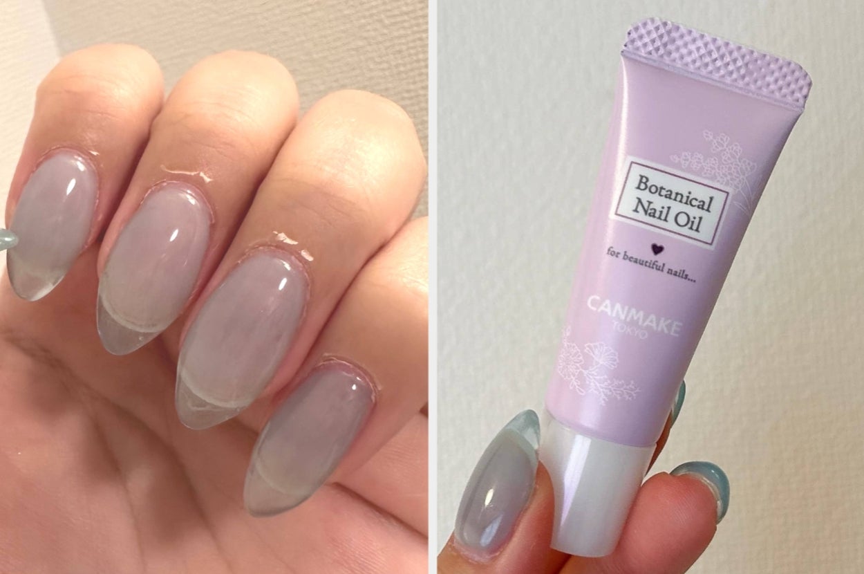 手に長いアーモンド形の透明なネイルデザイン。