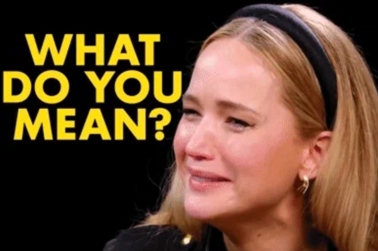 Close-up of a woman with a headband, smiling and looking puzzled, next to large text: "WHAT DO YOU MEAN?" This image is humorous, often used as a meme