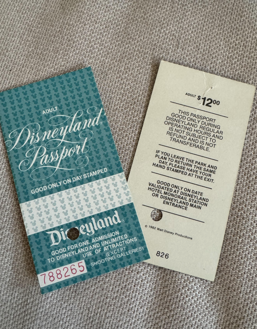Old Disneyland passport ticket from 1982 with terms on the back detailing admission and restrictions. Price listed as $12.00