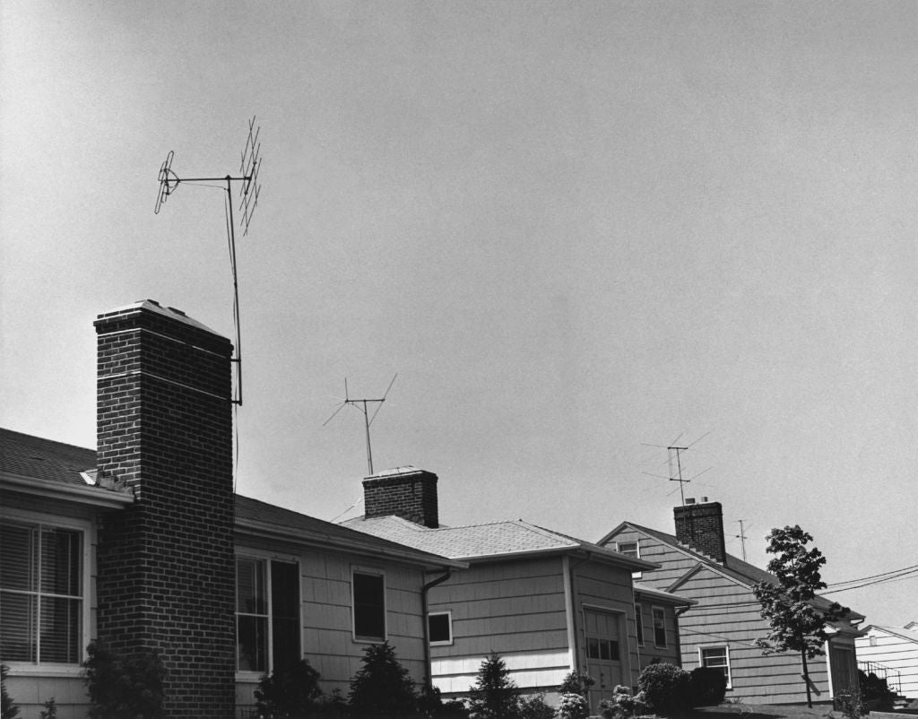 Rooftops of suburban houses with TV antennas; nonfiction  categorized arsenic  Parents