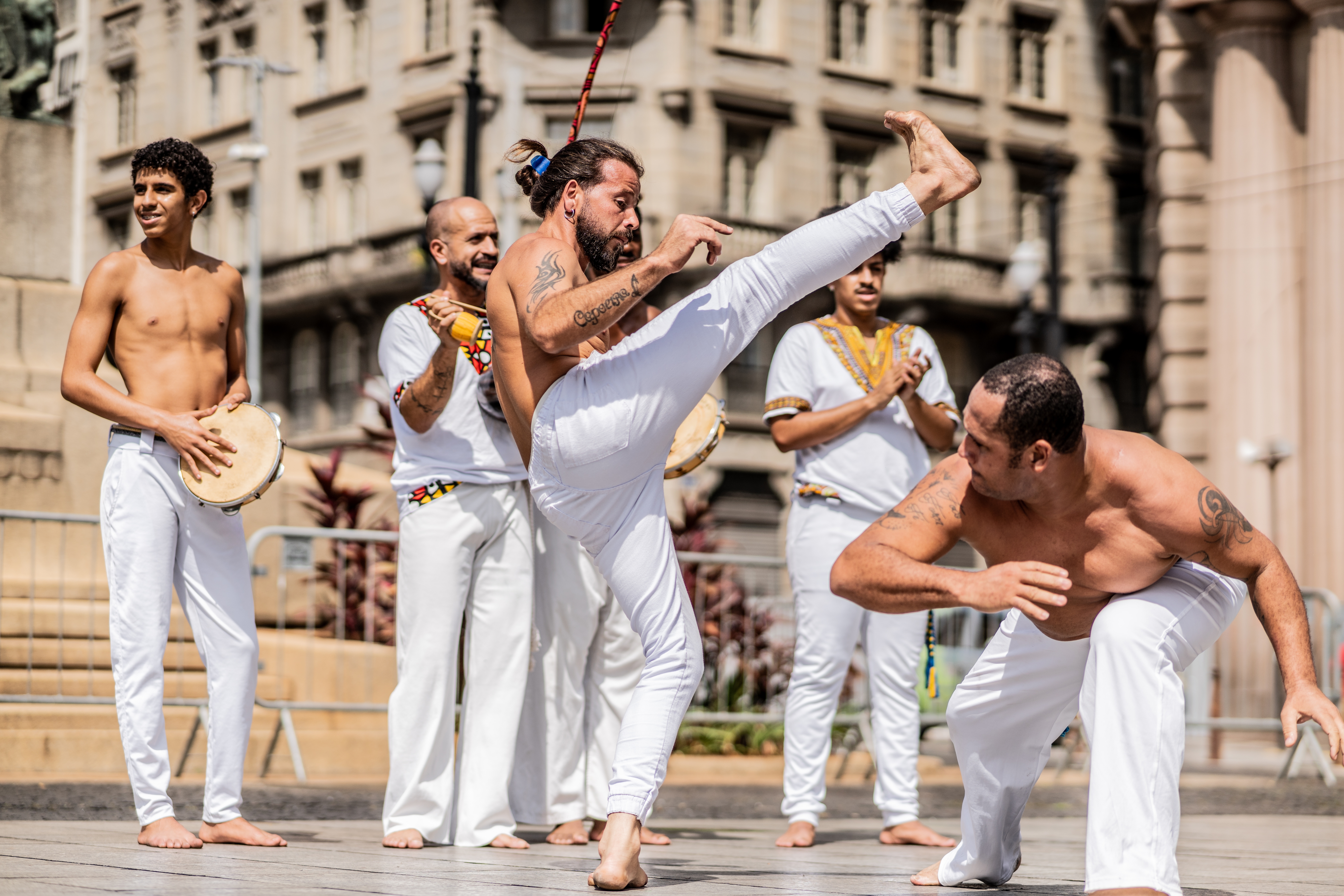 Performers show  capoeira, a Brazilian martial creation  combining dance, acrobatics, and music, successful  a nationalist   square. They deterioration  accepted   achromatic  attire