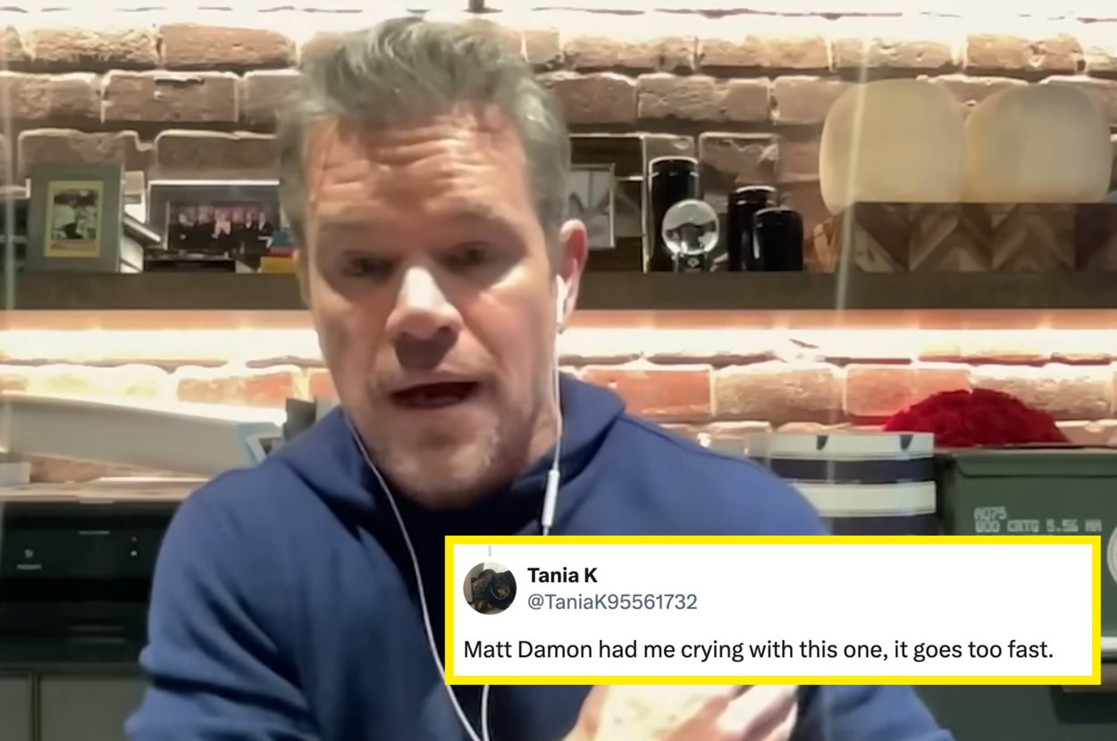 Man in a casual setting wearing a hoodie, speaking with earbuds in, against a backdrop of books and decor on shelves