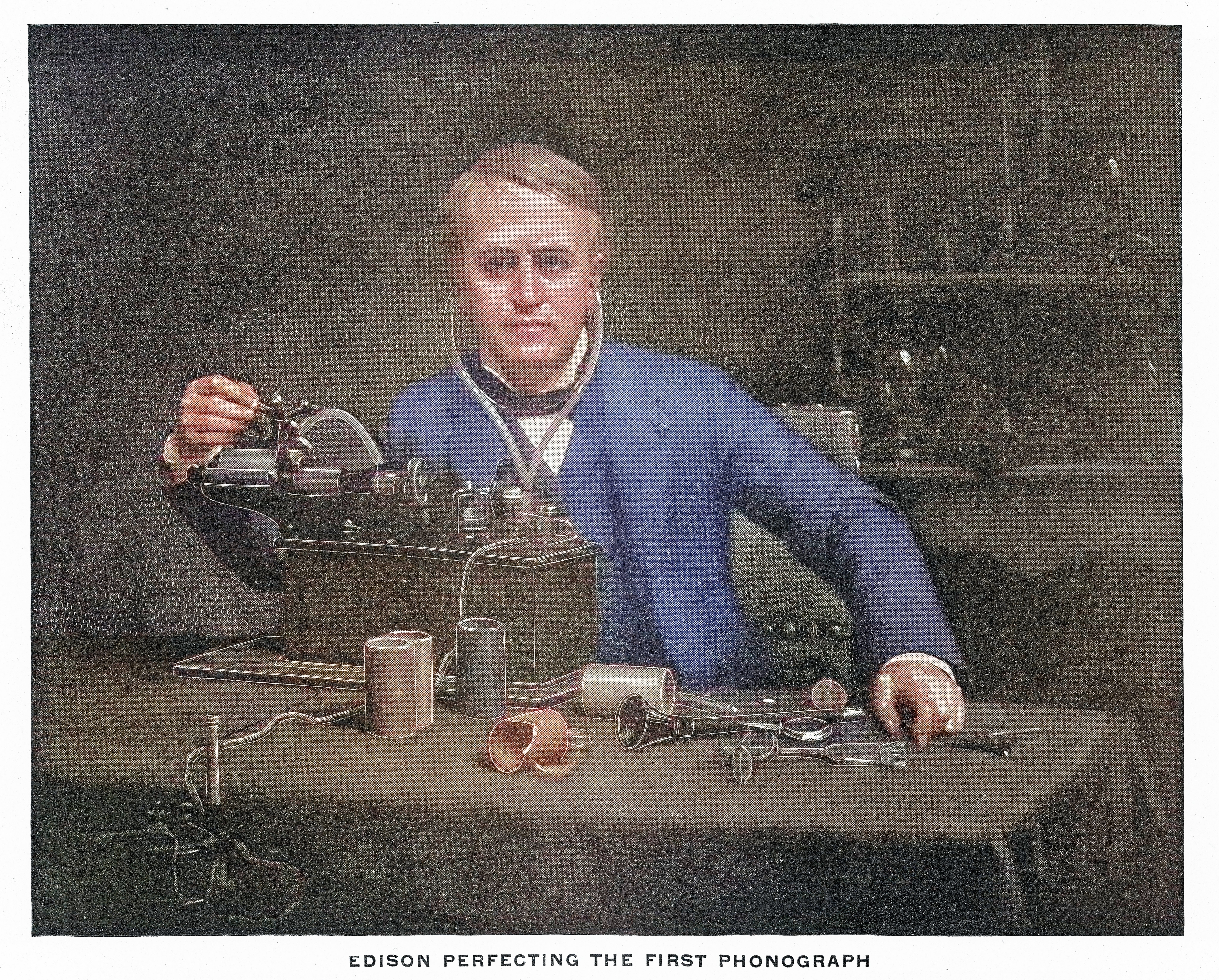 Ilustrasi Thomas Edison mengerjakan fonograf pertama, dikelilingi alat dan bahan di meja kerjanya