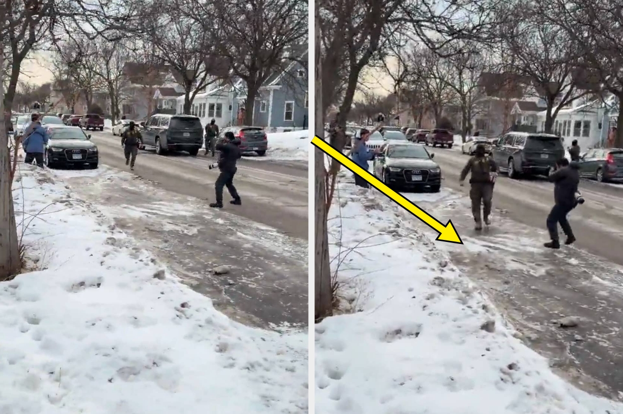 An armed officer chases an individual on a snowy street, with bystanders nearby