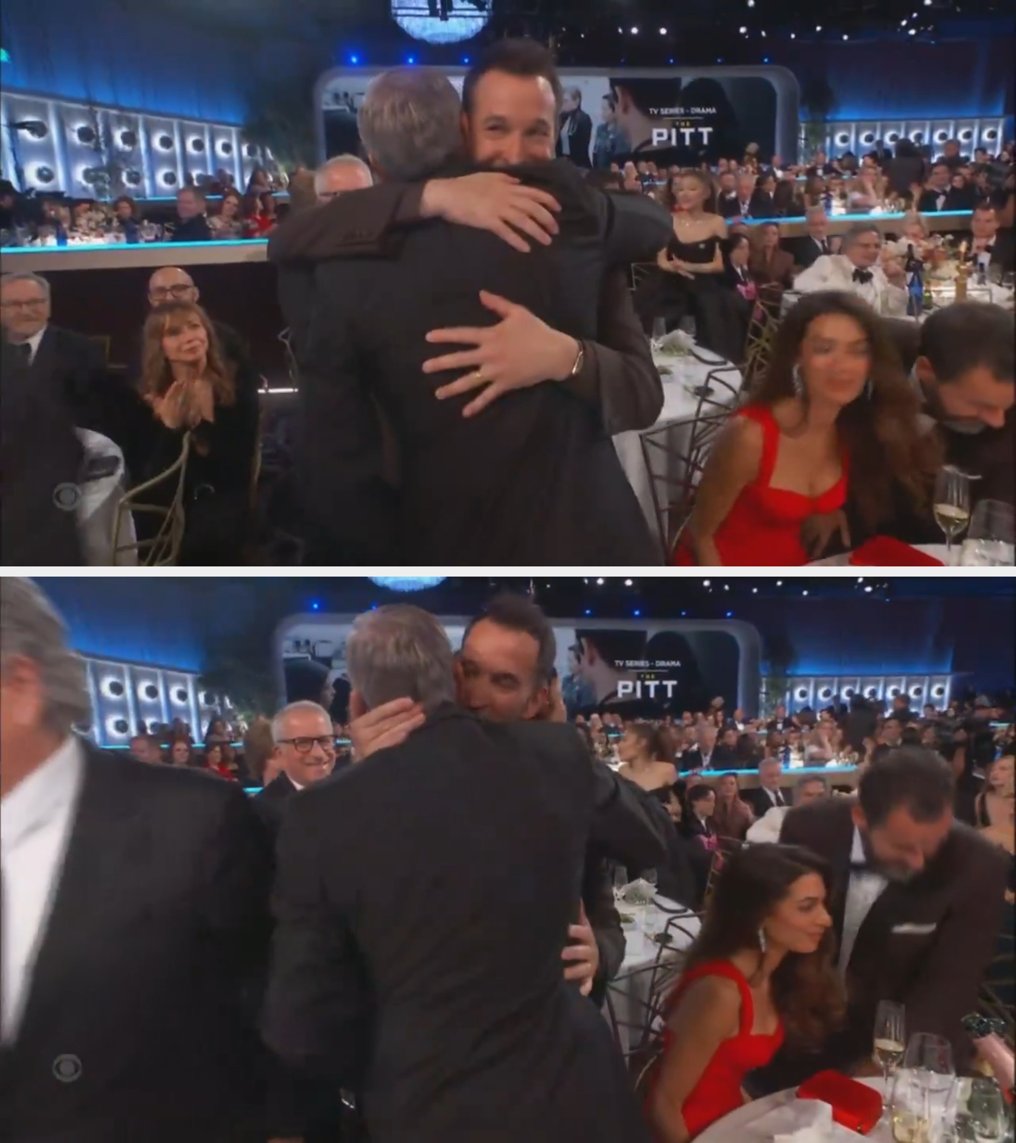 Two men hug astatine a ceremonial lawsuit successful a crowded venue. Attendees are seated astatine tables, immoderate clapping