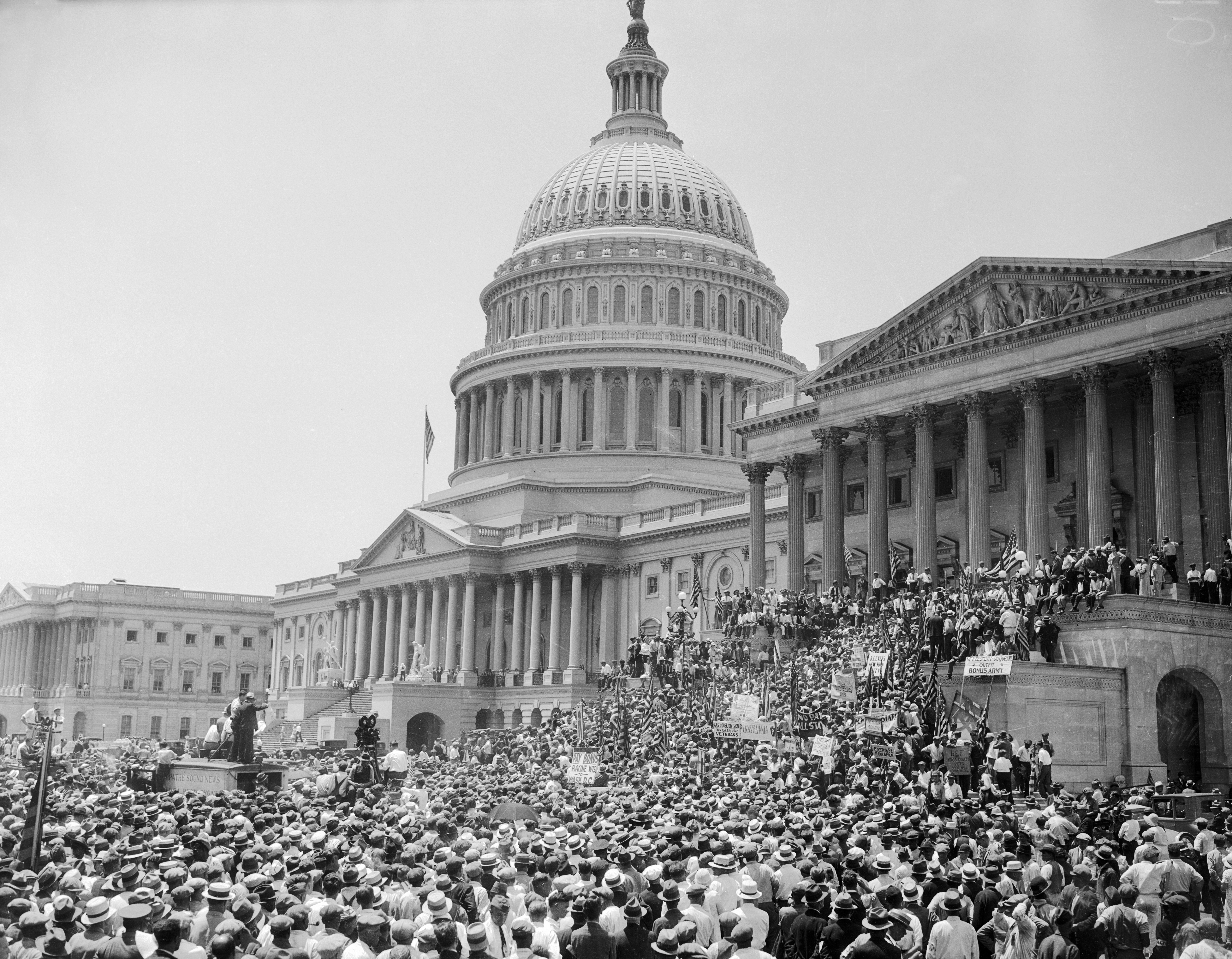 Large assemblage  gathered astatine  the U.S. Capitol for a women's suffrage lawsuit   successful  the aboriginal  1900s, with the Capitol dome prominently successful  the background