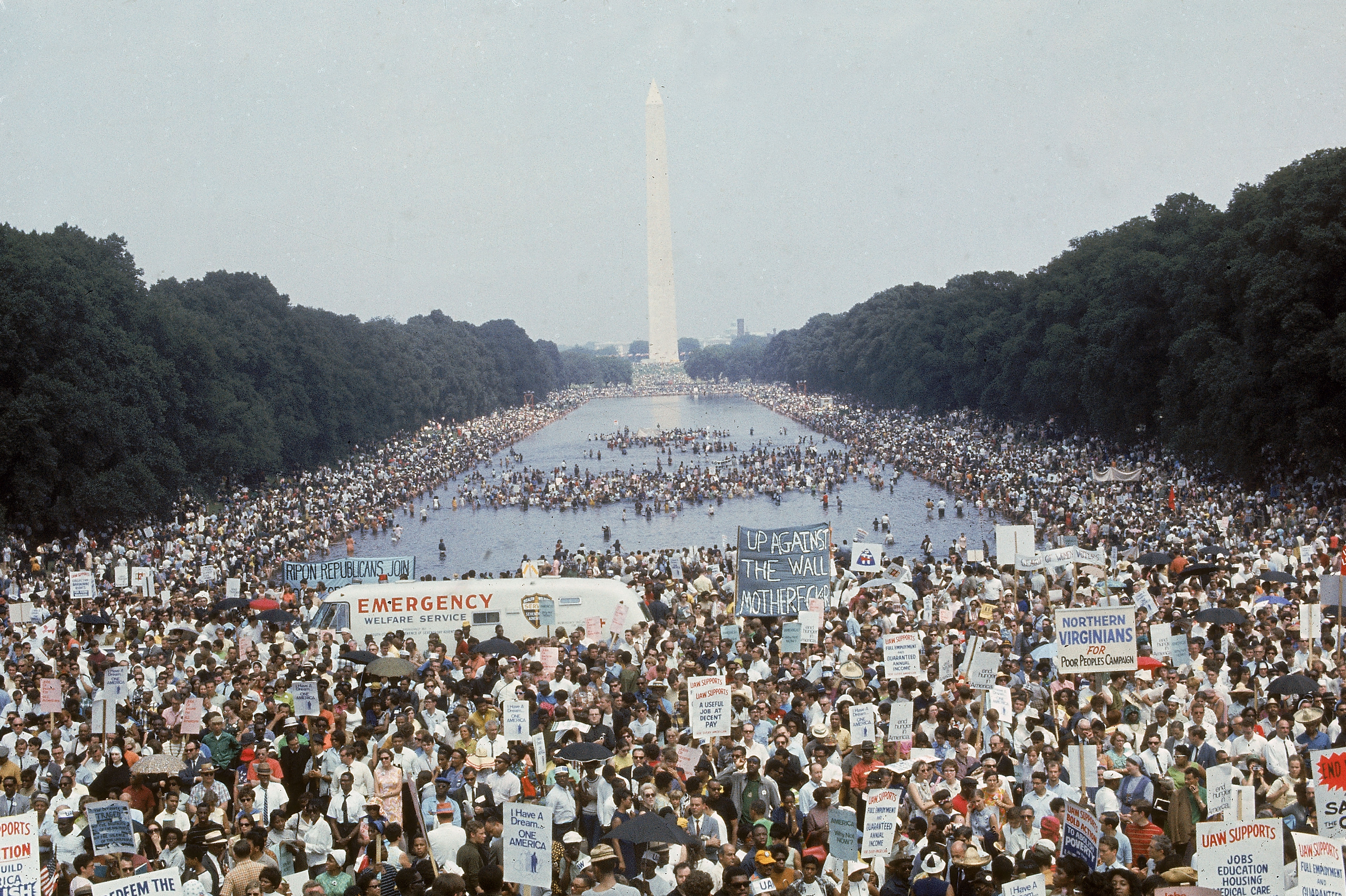 Large assemblage  gathers astatine  the National Mall successful  Washington D.C., with signs advocating for civilian  rights, adjacent   the Washington Monument