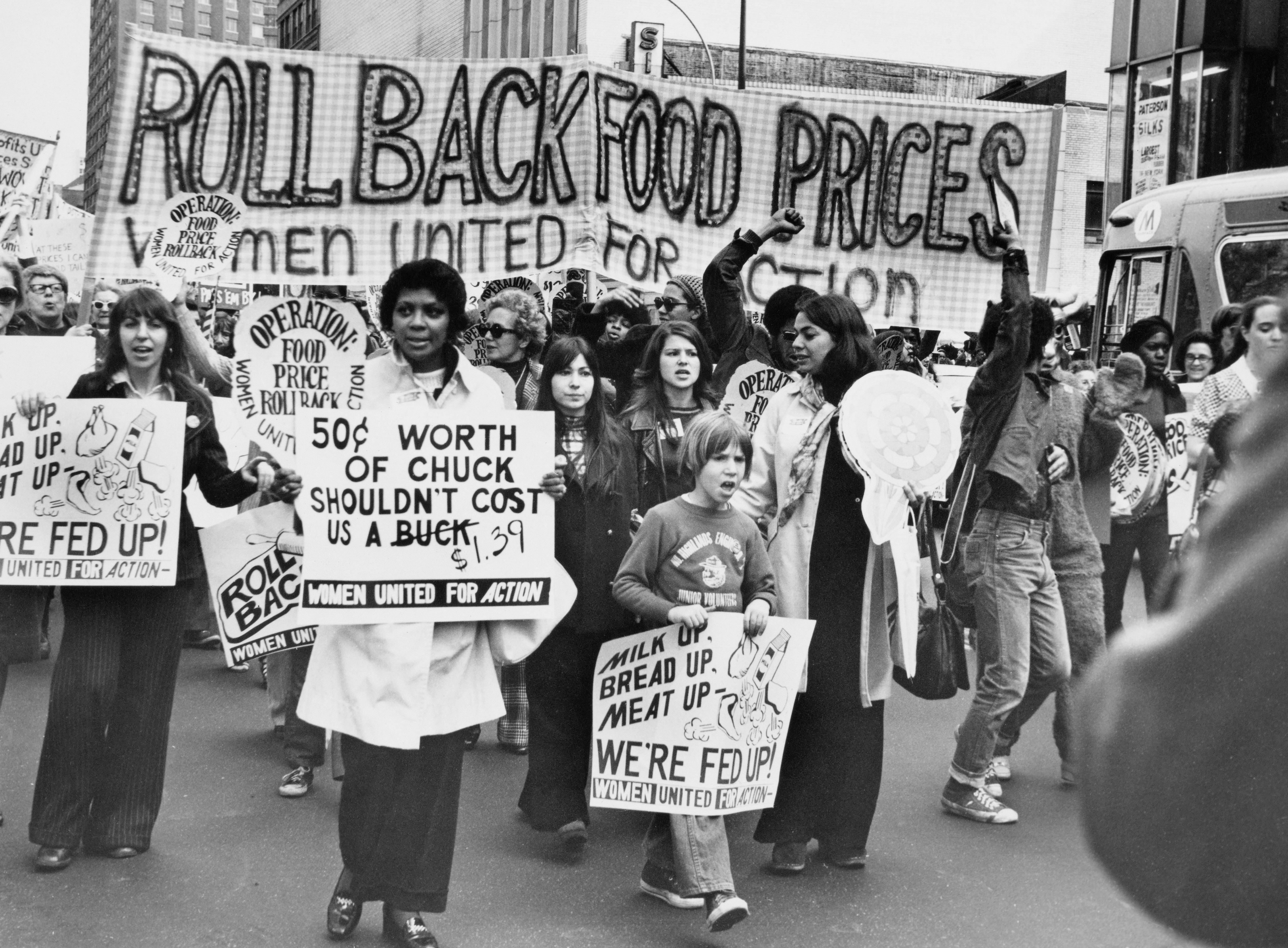 People march with signs demanding little   nutrient  prices, including "Roll Back Food Prices" and "Worth of Chuck Shouldn't Cost an Arm &amp;amp; a Leg"