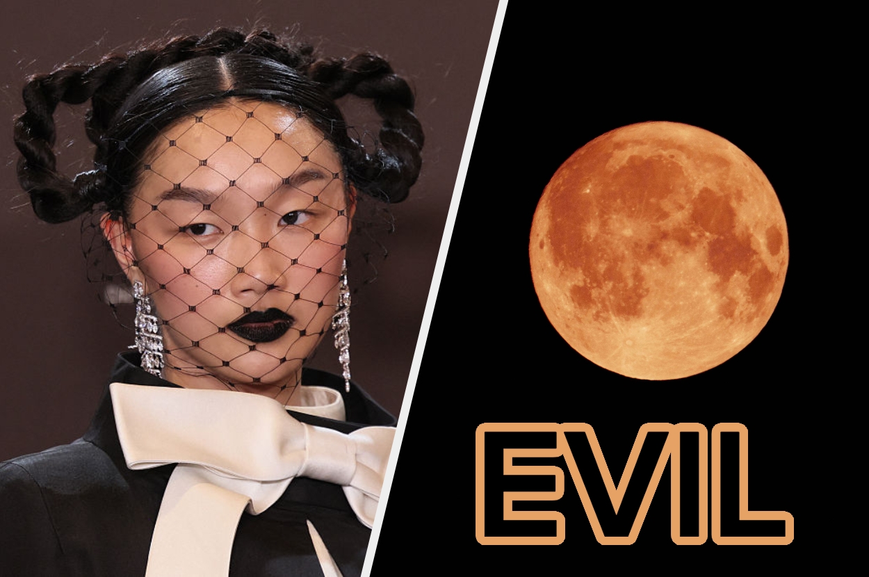 A person in a black netted face veil and bold jewelry stands next to an orange moon with the word "EVIL" below it