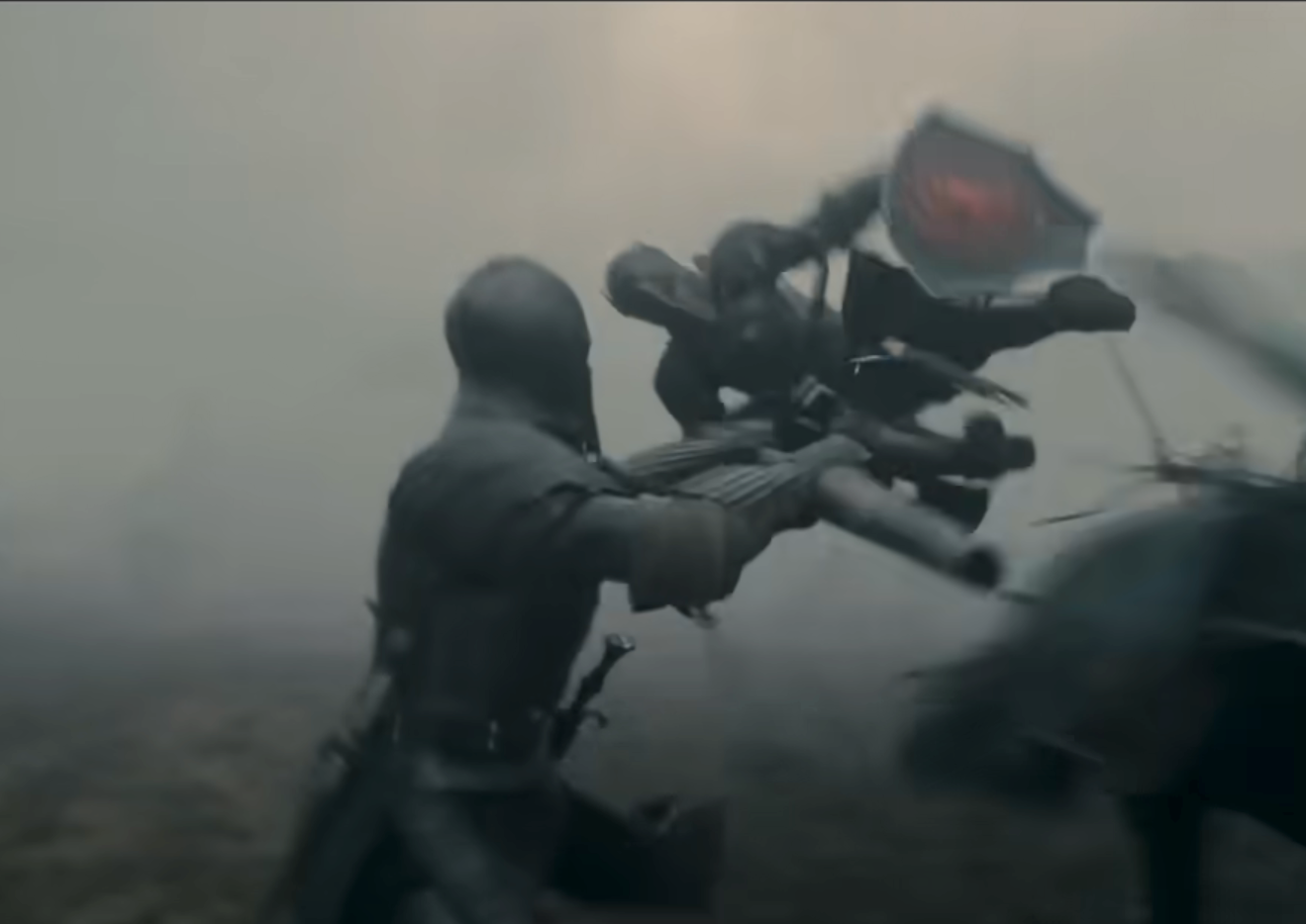 Two armored knights are in a dynamic sword fight amidst a foggy battlefield, with one knight in mid-air holding a shield