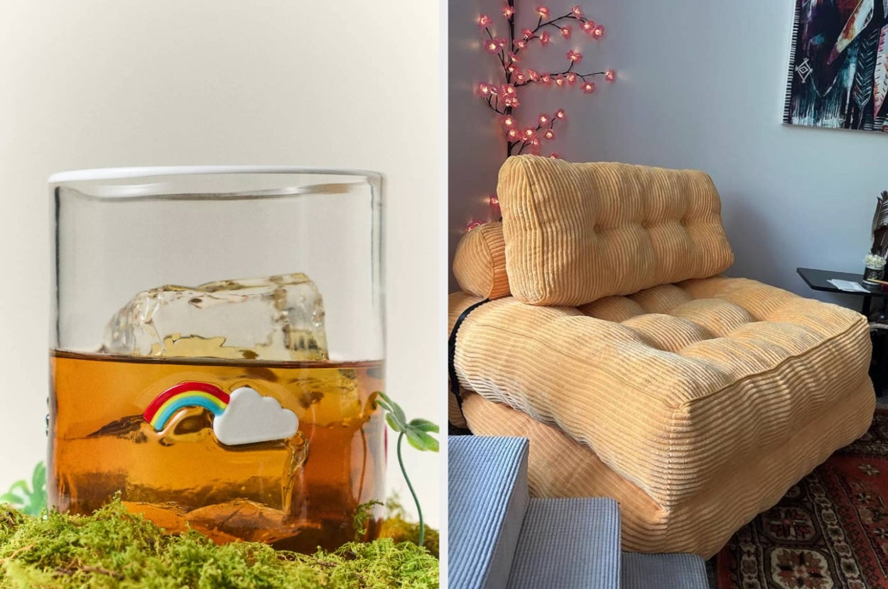 A cozy living room features a plush, tufted chair beside a small table with a decorative drink glass showcasing a rainbow and cloud charm