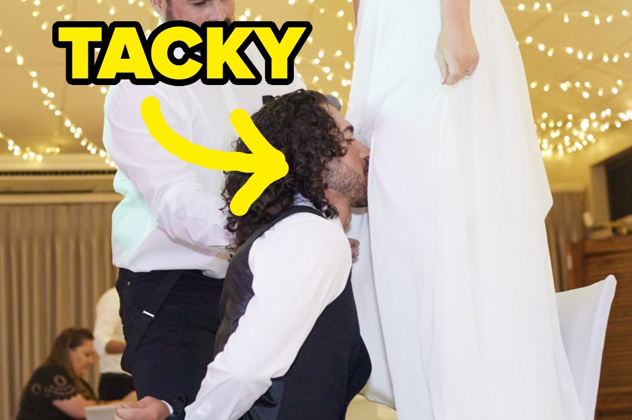 A man in formal attire removes a garter from a bride's leg during a wedding reception, with "Tacky" written above
