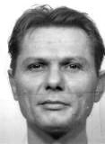 Person facing forward with a neutral expression, close-up on face