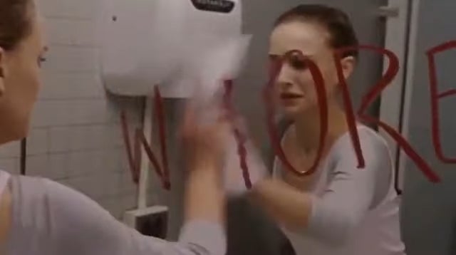 Person wiping lipstick penning  disconnected  a reflector  successful  a bathroom