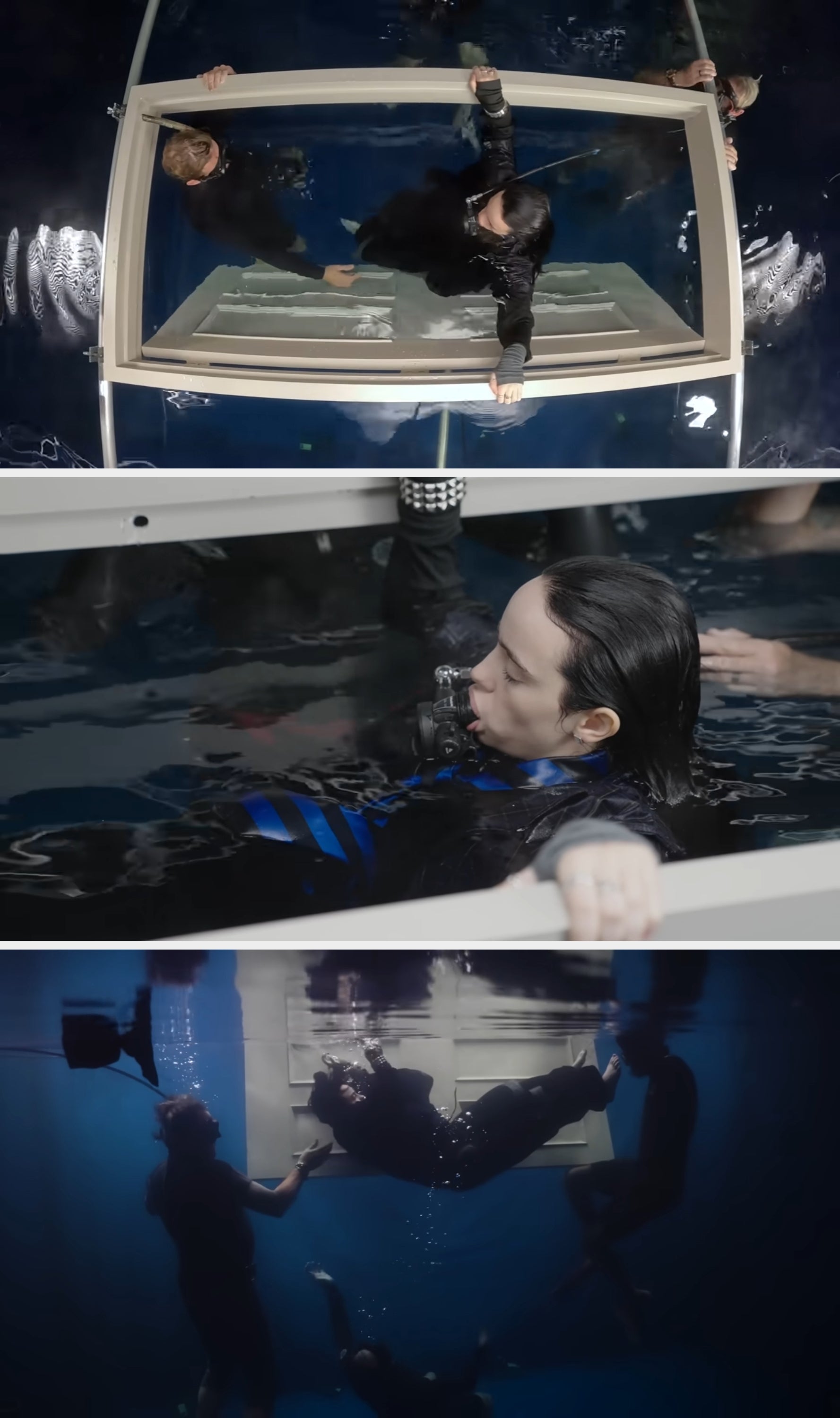 Person performing an underwater flight  stunt wrong  a ample  tank, assisted by 2  others