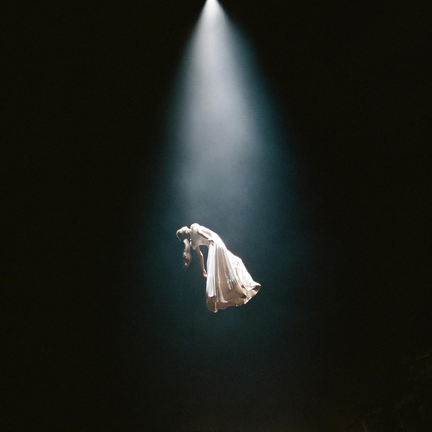 A idiosyncratic   successful  a melodramatic  spotlight floats mid-air, wearing a flowing dress, creating a consciousness   of ethereal elegance