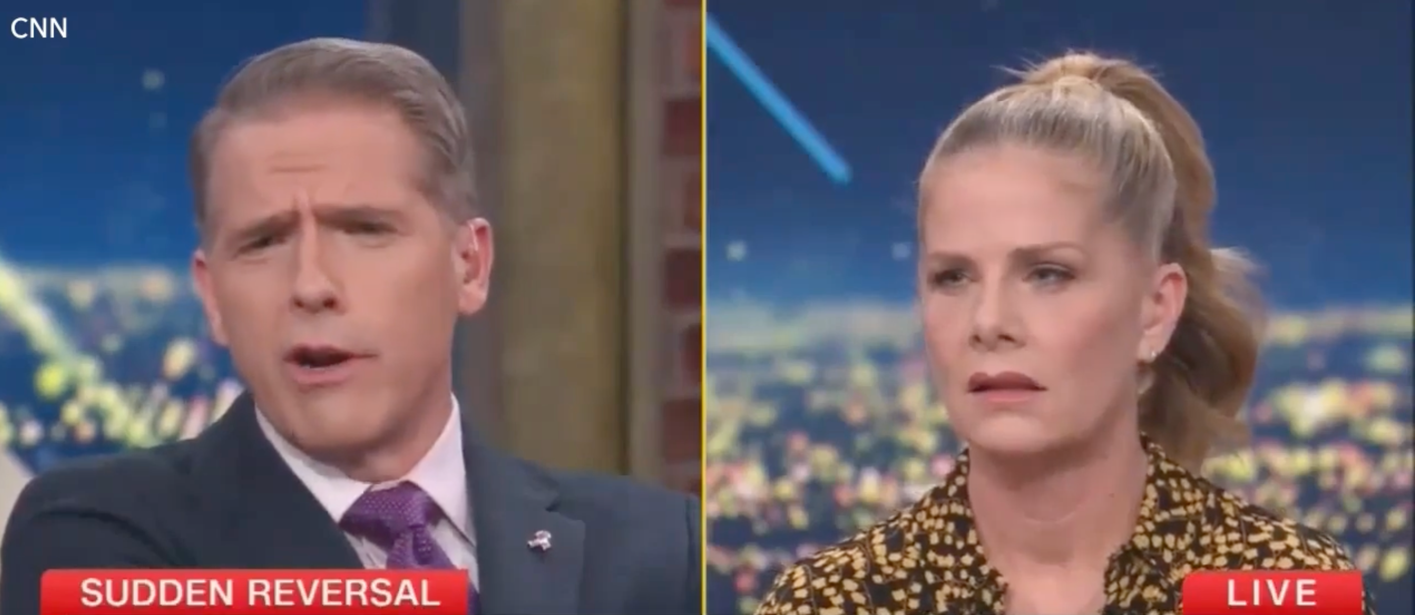 Two news anchors with serious expressions are on live TV, discussing a sudden reversal