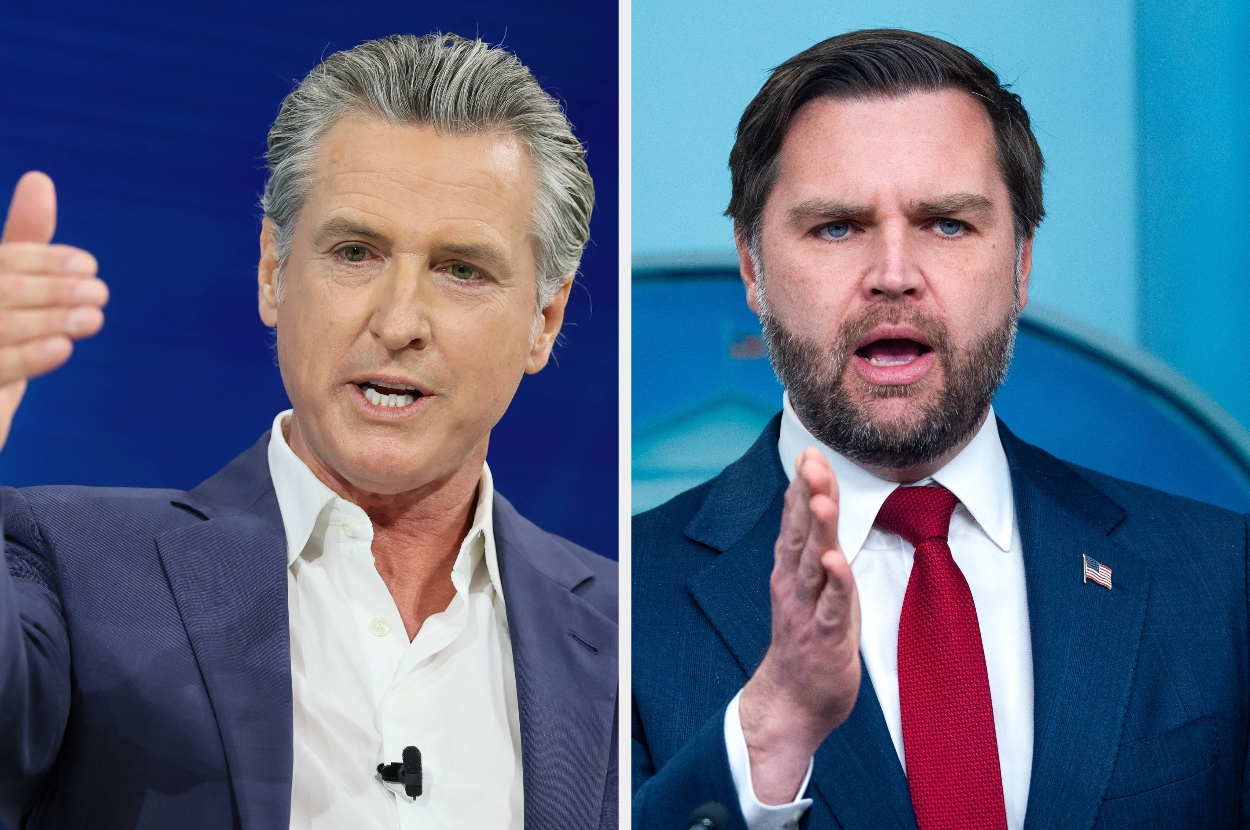 Two men in formal attire speak, gesturing with their hands. Both wear suits and express confident, emphatic expressions